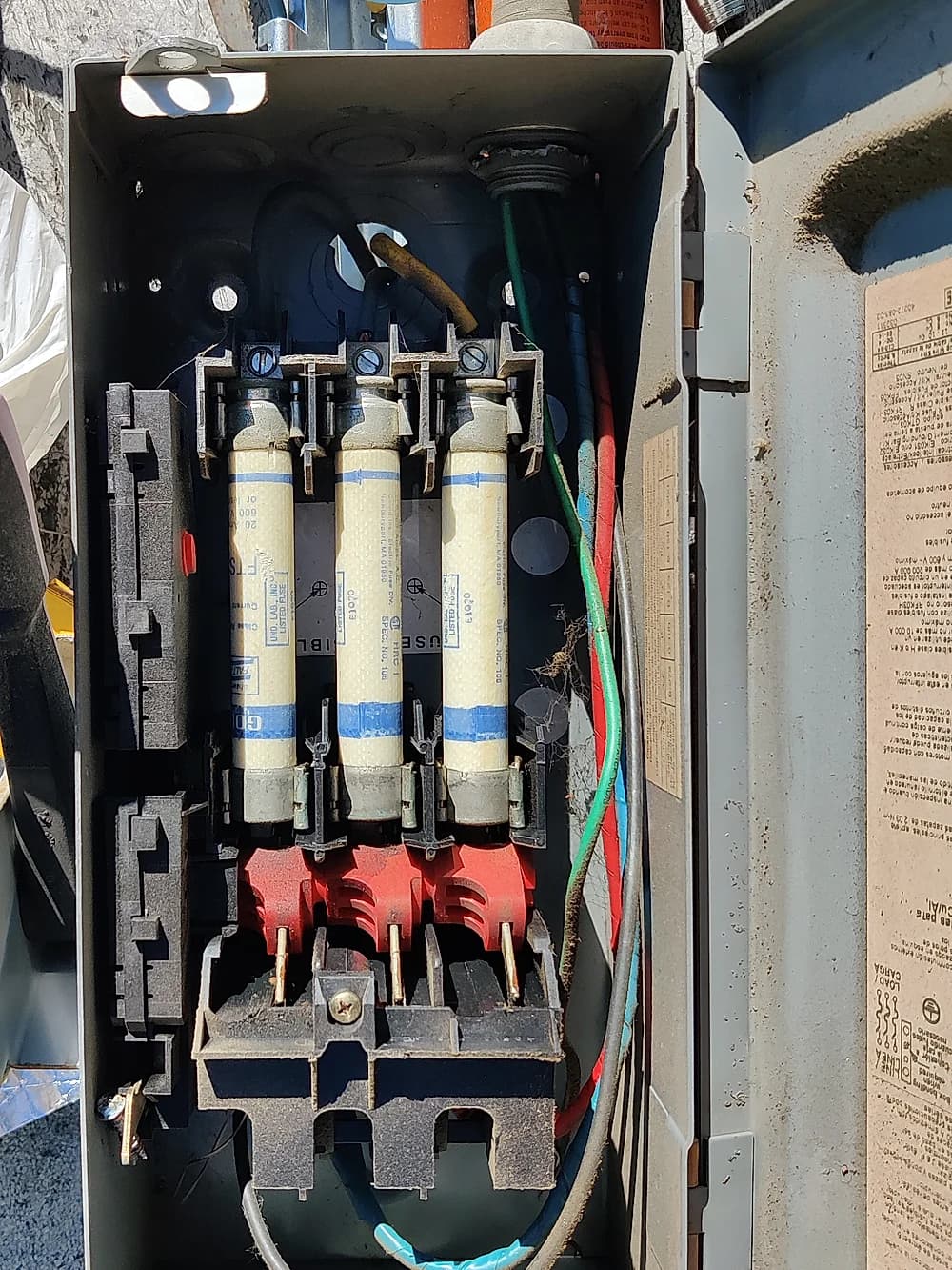 Open electrical disconnect panel during an HVAC service call