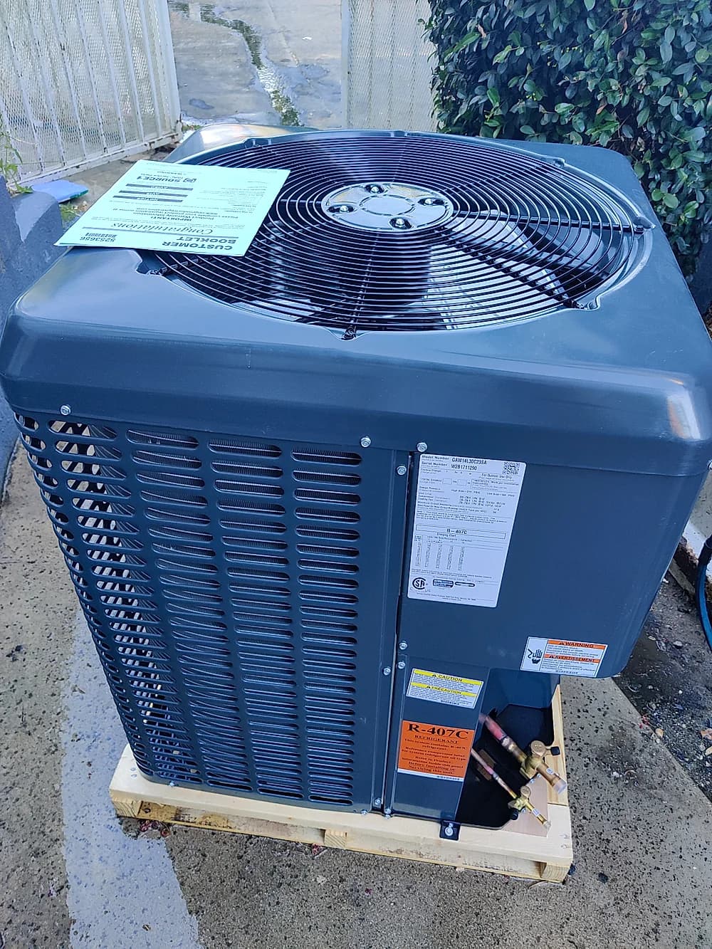 Brand-new residential condenser unit staged and ready for installation