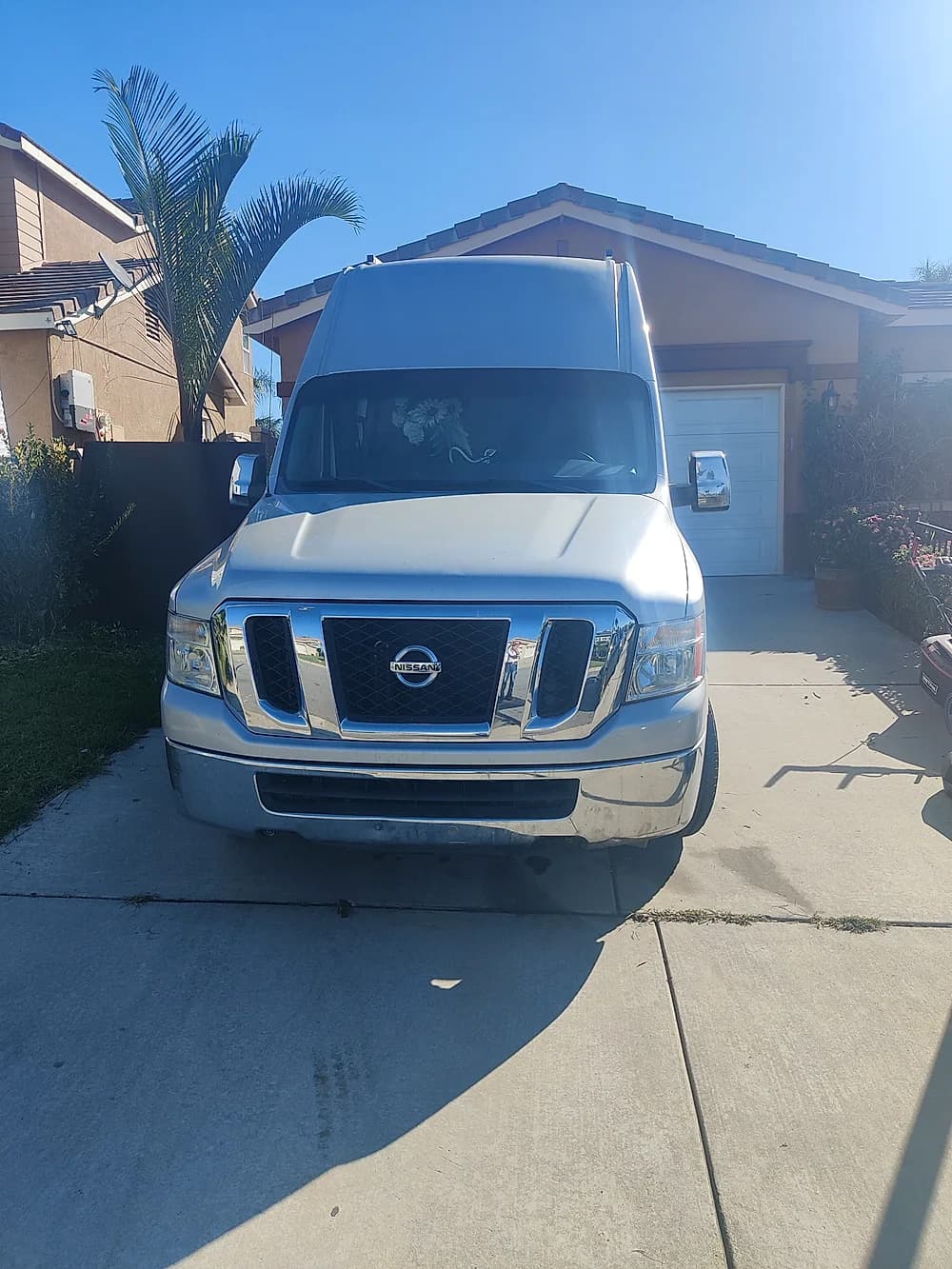 Trust Heating and Air Conditioning van arriving at a residential job site
